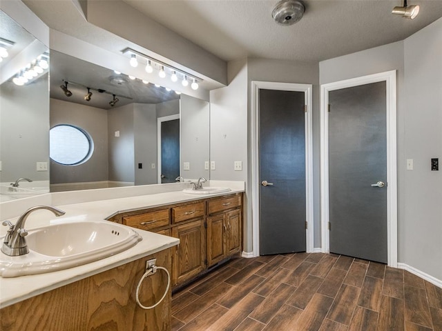 320 N Jasper Way, Mustang, OK 73064 - full bathroom with double vanity and wood finished floors