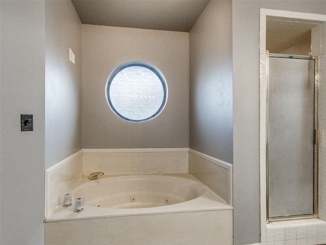 320 N Jasper Way, Mustang, OK 73064 - full bath featuring a shower stall and a tub with jets