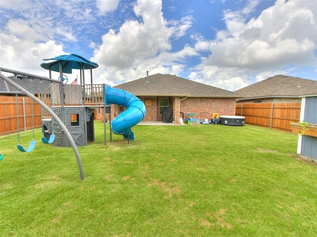 8025 Waters Edge Way, Del City, OK 73135 - rear view of house featuring a playground, brick siding, and roof with shingles