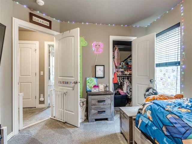 8025 Waters Edge Way, Del City, OK 73135 - carpeted bedroom featuring a walk in closet and a closet