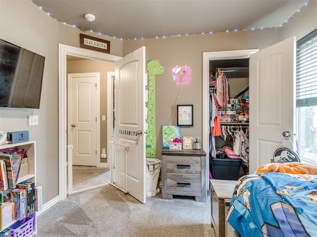 8025 Waters Edge Way, Del City, OK 73135 - bedroom with light colored carpet, a closet, multiple windows, and a walk in closet