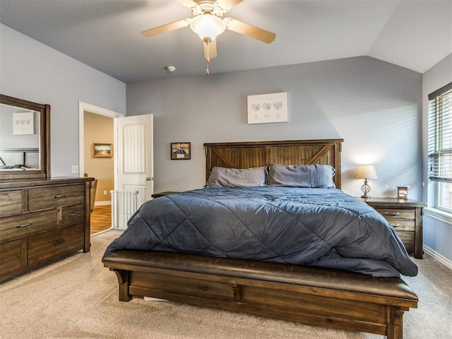 8025 Waters Edge Way, Del City, OK 73135 - bedroom featuring light colored carpet, vaulted ceiling, and a ceiling fan