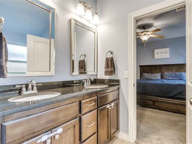 8025 Waters Edge Way, Del City, OK 73135 - ensuite bathroom with double vanity and a ceiling fan