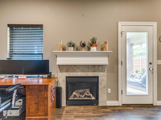 8025 Waters Edge Way, Del City, OK 73135 - home office with a fireplace and wood finished floors