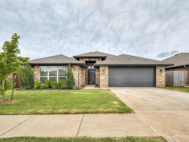 11604 SW 9th St, Yukon, OK 73099 - view of front of house with driveway, an attached garage, and brick siding