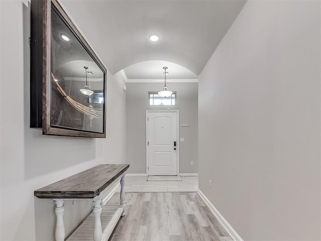 11604 SW 9th St, Yukon, OK 73099 - entryway with ornamental molding, arched walkways, and light wood finished floors