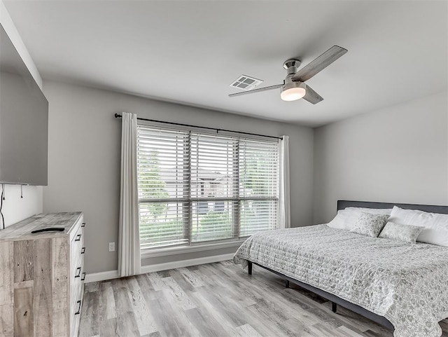 11604 SW 9th St, Yukon, OK 73099 - bedroom featuring light wood-style floors and a ceiling fan