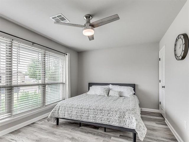 11604 SW 9th St, Yukon, OK 73099 - bedroom with wood finished floors and a ceiling fan