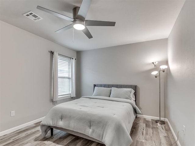 11604 SW 9th St, Yukon, OK 73099 - bedroom featuring wood finished floors and ceiling fan