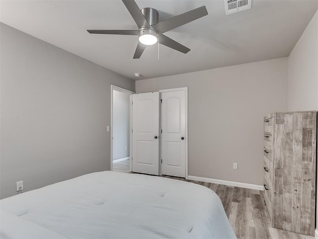 11604 SW 9th St, Yukon, OK 73099 - bedroom with wood finished floors and a ceiling fan