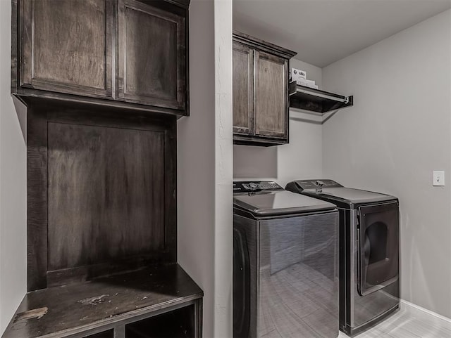 11604 SW 9th St, Yukon, OK 73099 - laundry area with washing machine and clothes dryer and cabinet space