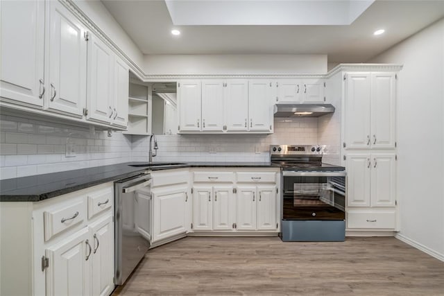 7913 Debar Cir, Oklahoma City, OK 73132 - kitchen with appliances with stainless steel finishes, white cabinetry, open shelves, dark countertops, and recessed lighting