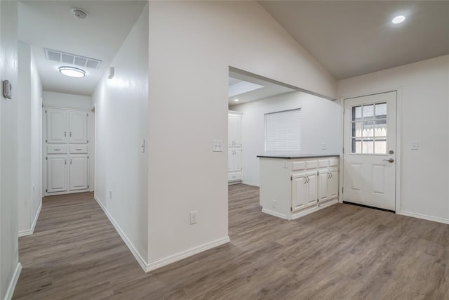 7913 Debar Cir, Oklahoma City, OK 73132 - foyer with wood finished floors, vaulted ceiling, and recessed lighting