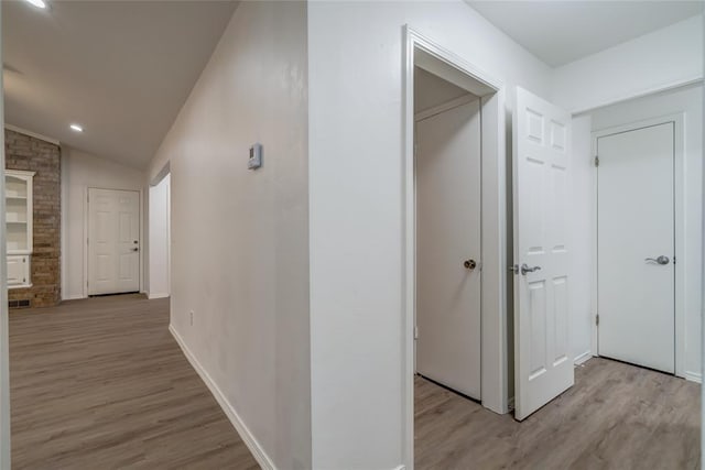 7913 Debar Cir, Oklahoma City, OK 73132 - hall featuring light wood-style floors, lofted ceiling, and recessed lighting