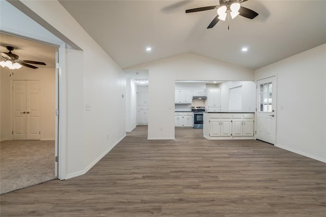 7913 Debar Cir, Oklahoma City, OK 73132 - unfurnished living room with ceiling fan, lofted ceiling, wood finished floors, and recessed lighting