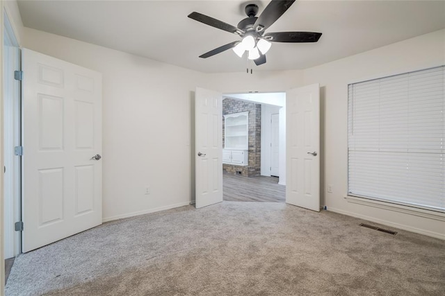 7913 Debar Cir, Oklahoma City, OK 73132 - unfurnished bedroom with carpet and ceiling fan