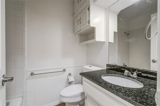 7913 Debar Cir, Oklahoma City, OK 73132 - full bathroom featuring vanity, a wainscoted wall, and shower / washtub combination