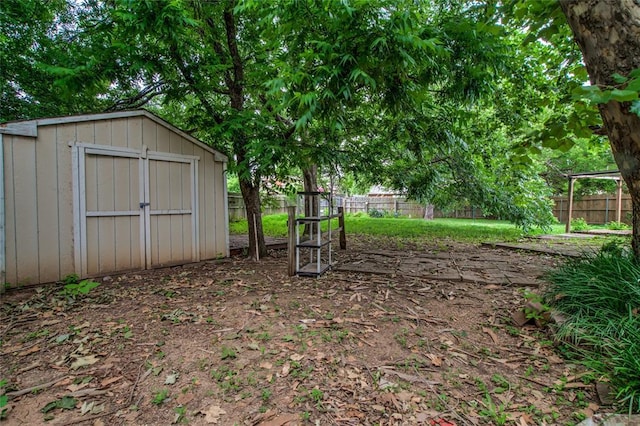 7913 Debar Cir, Oklahoma City, OK 73132 - fenced backyard featuring a storage shed