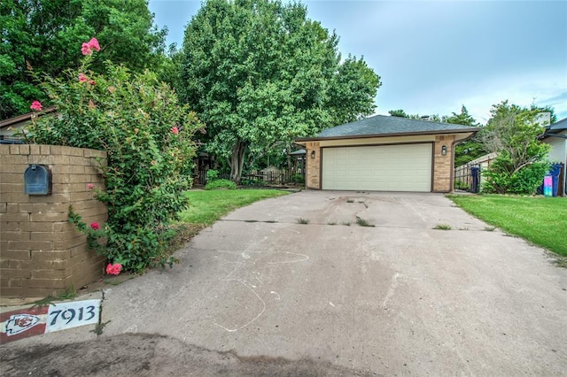 7913 Debar Cir, Oklahoma City, OK 73132 - garage featuring concrete driveway