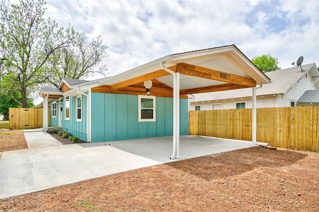 800 SW 26th St, Oklahoma City, OK 73109 - exterior space with board and batten siding, a carport, and a patio area