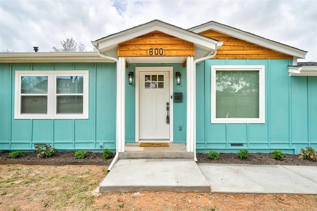 800 SW 26th St, Oklahoma City, OK 73109 - doorway to property featuring board and batten siding