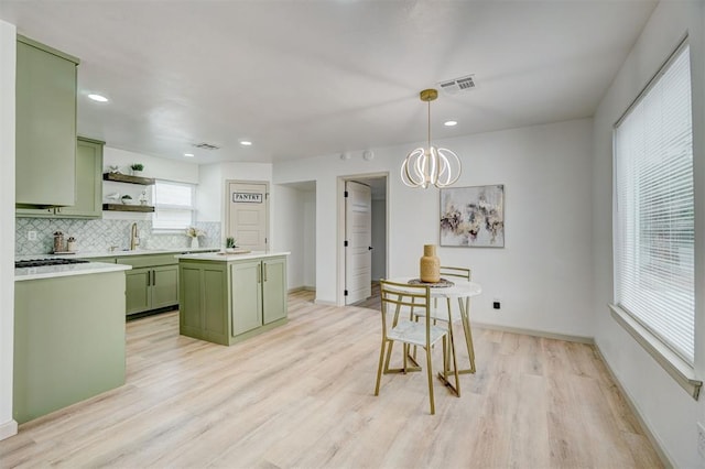 800 SW 26th St, Oklahoma City, OK 73109 - kitchen featuring green cabinetry, light wood finished floors, open shelves, decorative backsplash, and recessed lighting