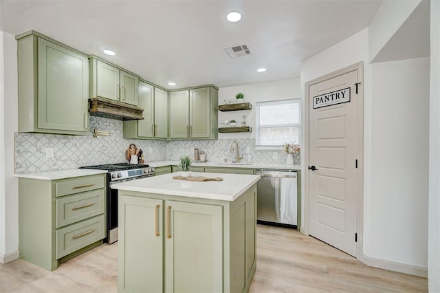 800 SW 26th St, Oklahoma City, OK 73109 - kitchen featuring green cabinets, appliances with stainless steel finishes, under cabinet range hood, open shelves, and recessed lighting