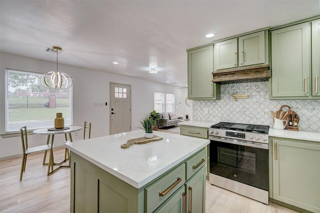 800 SW 26th St, Oklahoma City, OK 73109 - kitchen featuring green cabinetry, gas stove, under cabinet range hood, backsplash, and recessed lighting