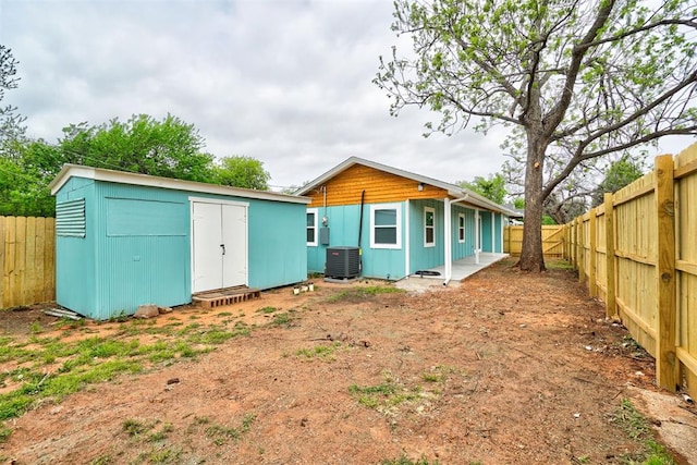 800 SW 26th St, Oklahoma City, OK 73109 - rear view of house with a fenced backyard and a storage shed