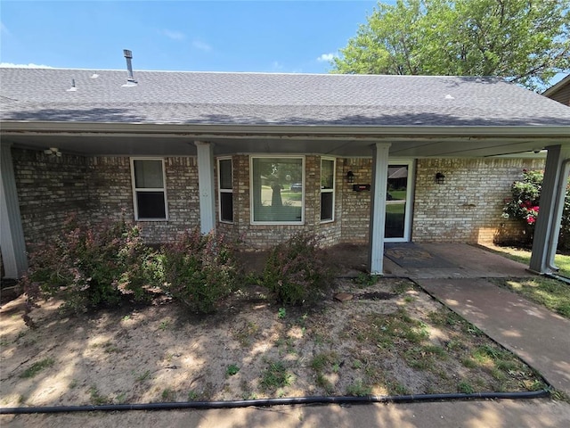 5621 NW 83rd St, Oklahoma City, OK 73132 - ranch-style home with a shingled roof and brick siding