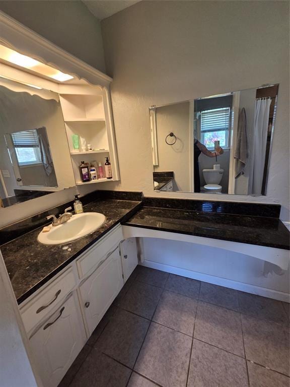 5621 NW 83rd St, Oklahoma City, OK 73132 - full bath with vanity, tile patterned flooring, and healthy amount of natural light