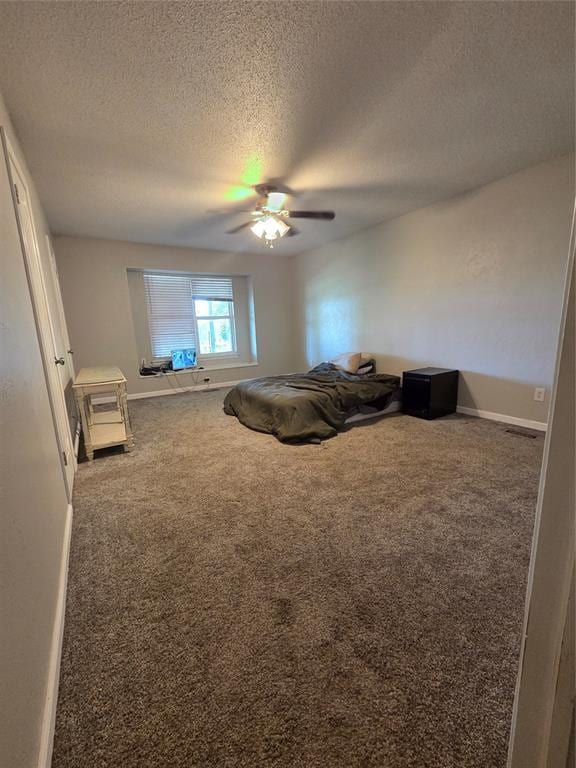 5621 NW 83rd St, Oklahoma City, OK 73132 - carpeted bedroom with a textured ceiling and a ceiling fan
