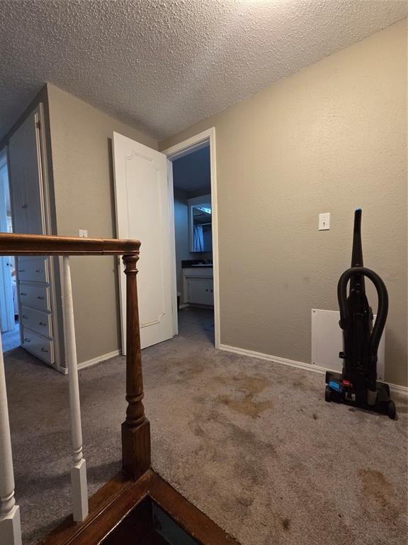 5621 NW 83rd St, Oklahoma City, OK 73132 - exercise room featuring carpet flooring and a textured ceiling