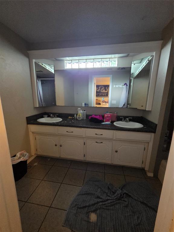 5621 NW 83rd St, Oklahoma City, OK 73132 - full bath with double vanity and tile patterned flooring