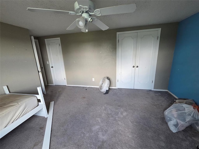 5621 NW 83rd St, Oklahoma City, OK 73132 - unfurnished bedroom featuring a textured ceiling, carpet flooring, a ceiling fan, and a closet