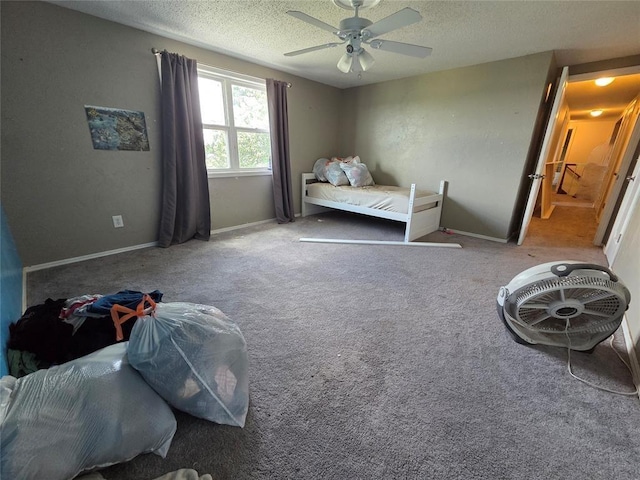 5621 NW 83rd St, Oklahoma City, OK 73132 - bedroom with a textured ceiling, carpet flooring, and a ceiling fan