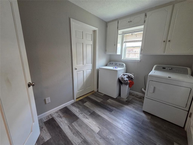 5621 NW 83rd St, Oklahoma City, OK 73132 - laundry area featuring washer and dryer, a textured ceiling, wood finished floors, and cabinet space
