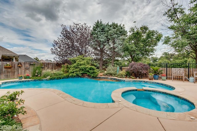 16204 Old Olive Way, Edmond, OK 73013 - view of pool with a patio, a fenced backyard, and a pool with connected hot tub