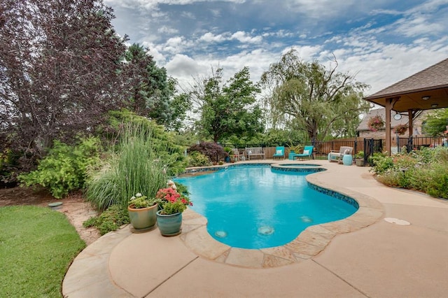 16204 Old Olive Way, Edmond, OK 73013 - view of swimming pool featuring a patio and a pool with connected hot tub