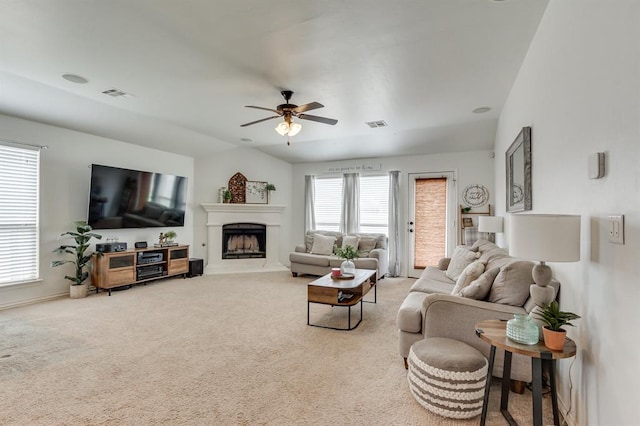11316 NW 94th St, Yukon, OK 73099 - living room featuring a ceiling fan, carpet, and a fireplace with raised hearth