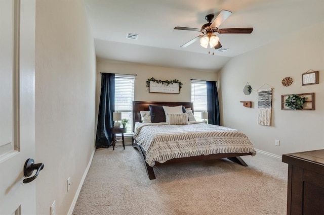 11316 NW 94th St, Yukon, OK 73099 - bedroom with light carpet, multiple windows, and a ceiling fan