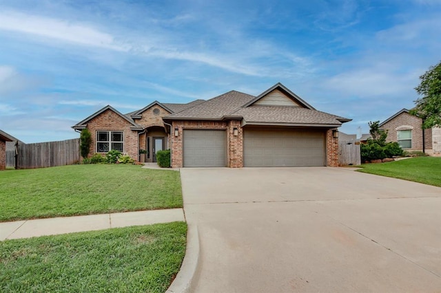 9124 NW 90th Cir, Yukon, OK 73099 - view of front of property with a garage, brick siding, concrete driveway, and roof with shingles