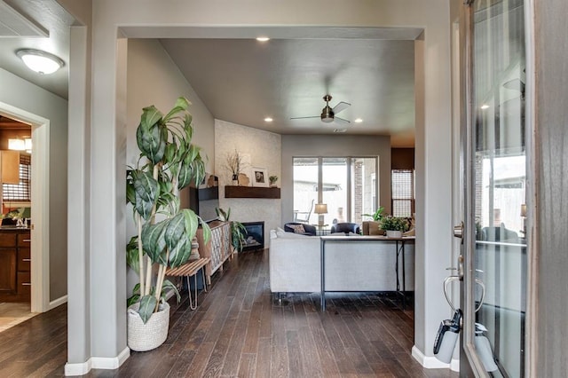 9124 NW 90th Cir, Yukon, OK 73099 - living area featuring dark wood-style flooring, ceiling fan, and a fireplace
