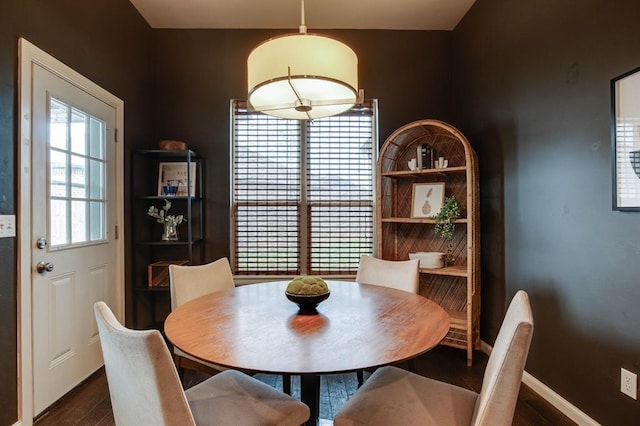 9124 NW 90th Cir, Yukon, OK 73099 - dining space featuring dark wood-style flooring and baseboards