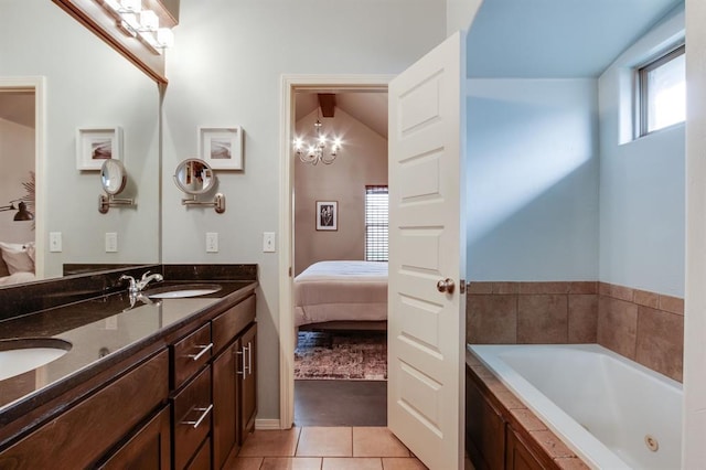 9124 NW 90th Cir, Yukon, OK 73099 - bathroom with connected bathroom, double vanity, a tub with jets, tile patterned flooring, and a chandelier
