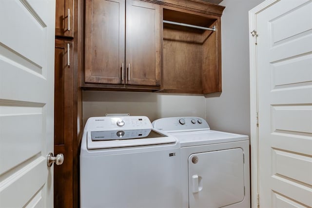9124 NW 90th Cir, Yukon, OK 73099 - washroom with separate washer and dryer and cabinet space