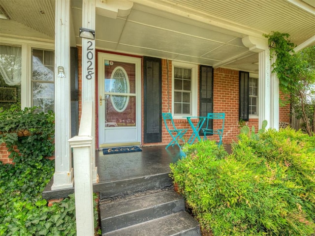 2028 Carlisle Rd, The Village, OK 73120 - entrance to property featuring brick siding and a porch