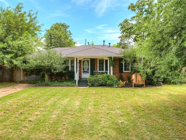 2028 Carlisle Rd, The Village, OK 73120 - view of front facade with a porch and brick siding
