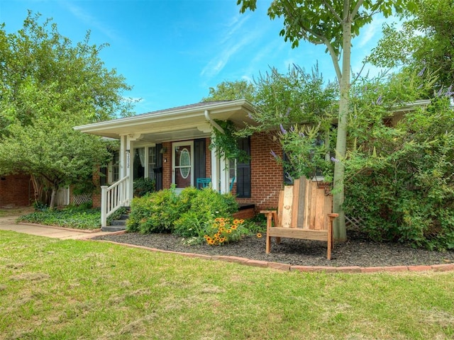 2028 Carlisle Rd, The Village, OK 73120 - view of front of house with a front lawn and a porch