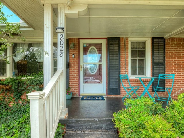 2028 Carlisle Rd, The Village, OK 73120 - entrance to property featuring a porch and brick siding
